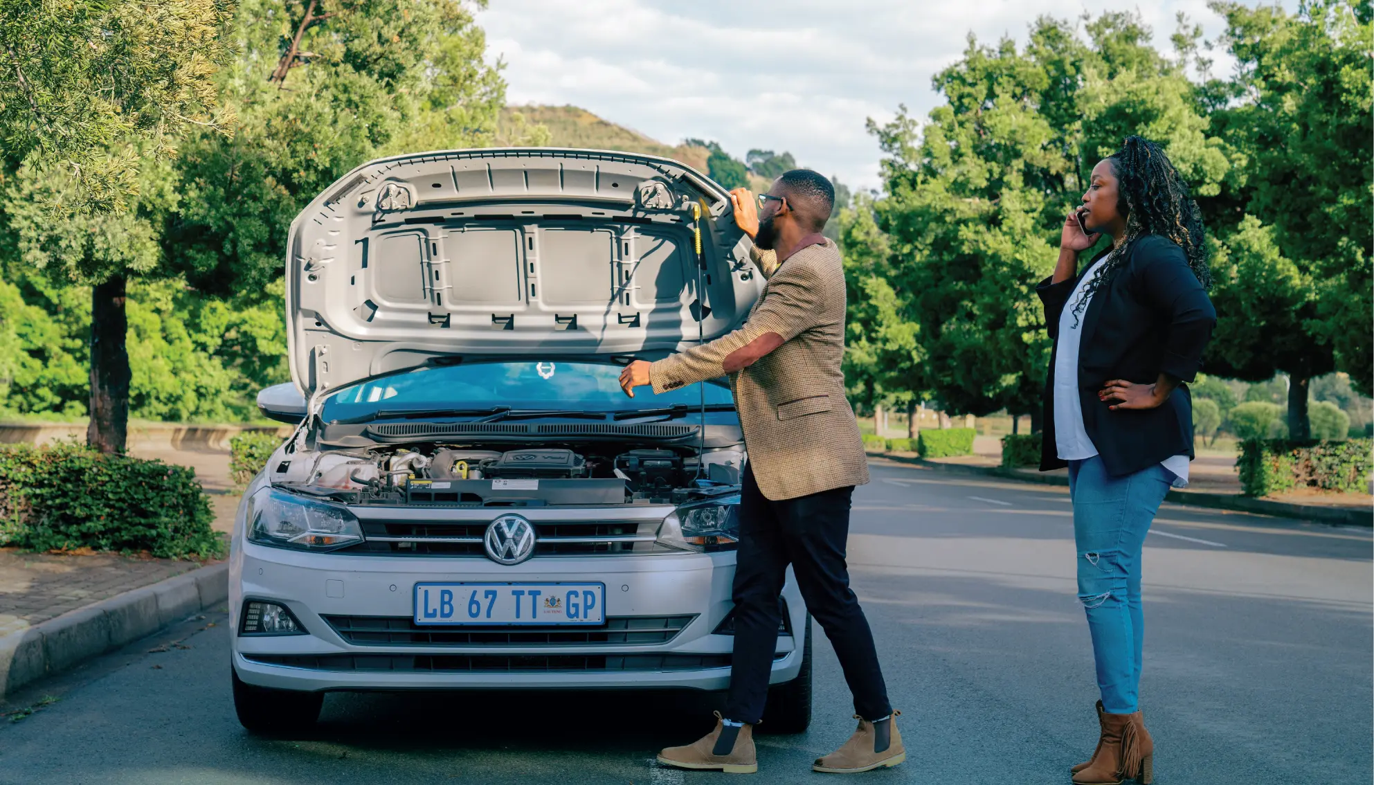 A man repairing and servicing a car