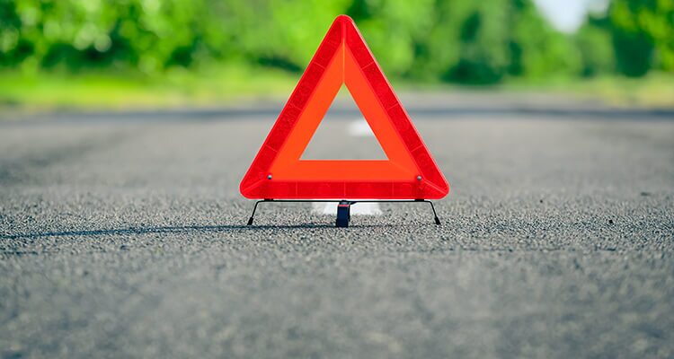 Red warning triangle in the middle of the road