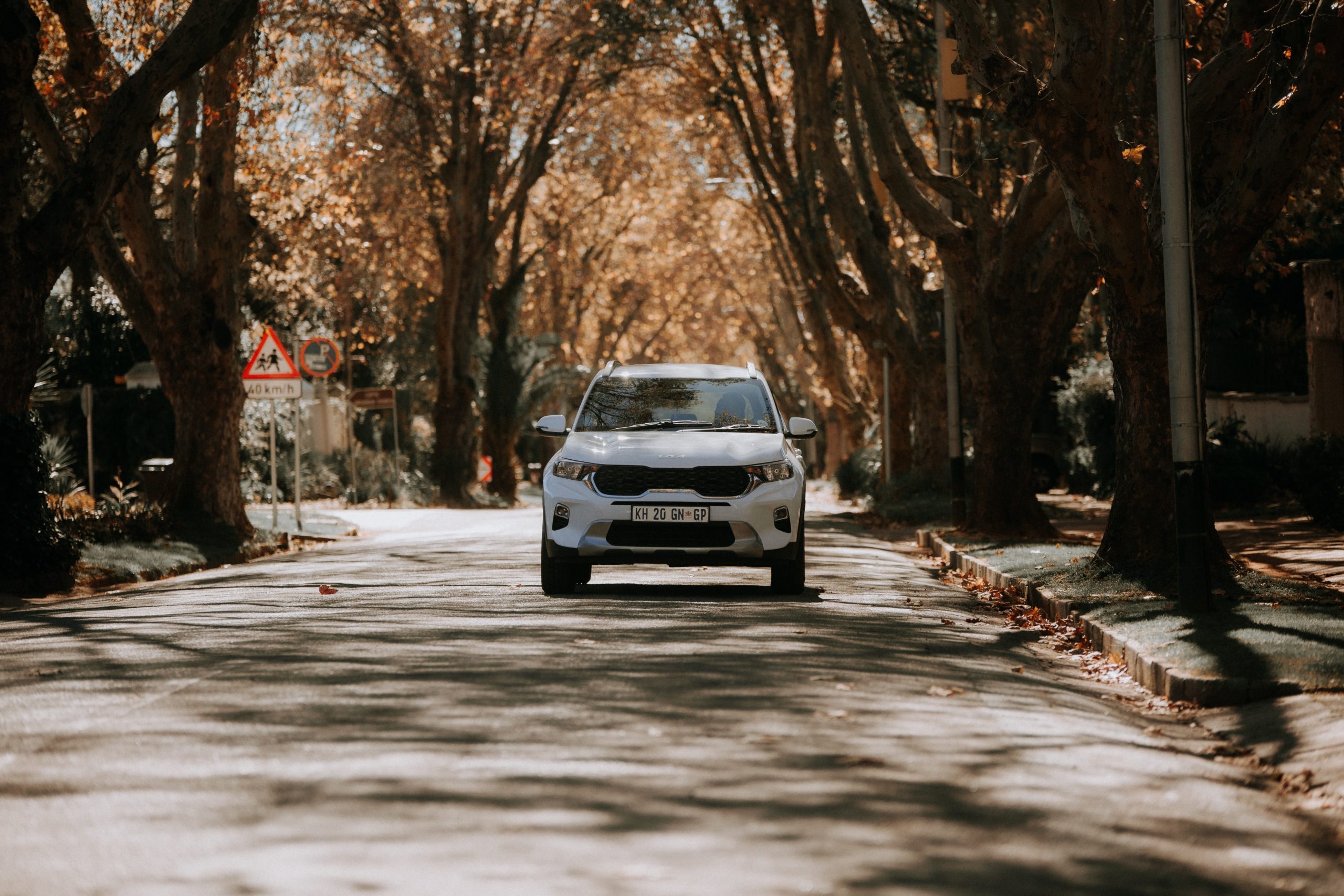 A car is driving down the road to show how driving could impact insurance premiums.