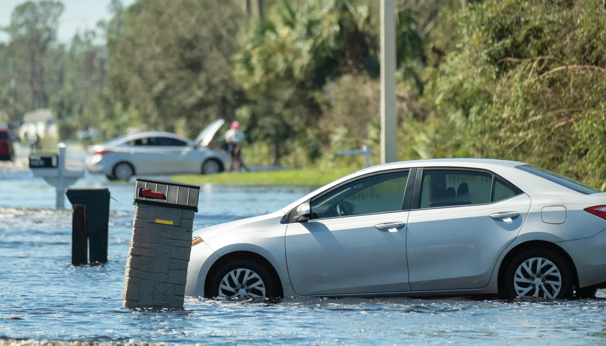 A car caught in a flood resulting from a natural disaster