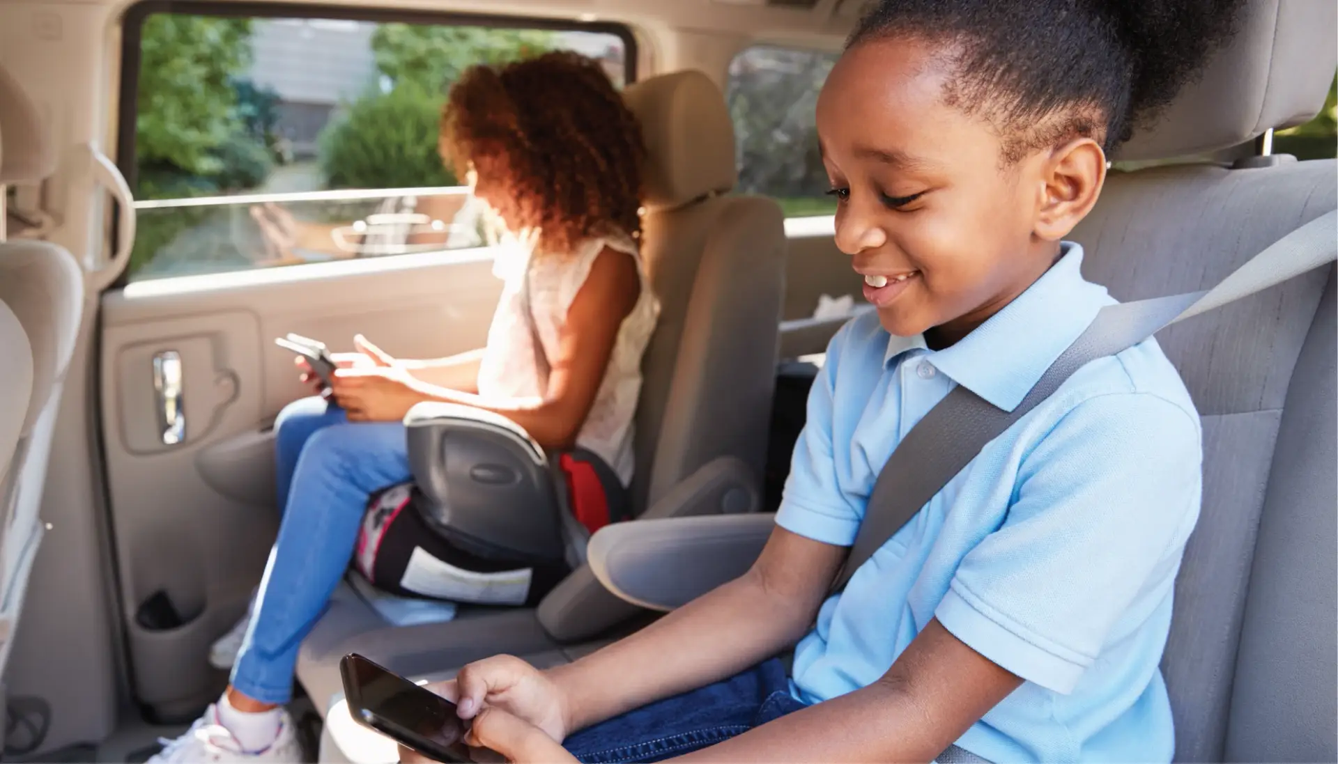A mom and daughter enjoying family car accessories
